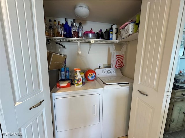 laundry area with washing machine and dryer