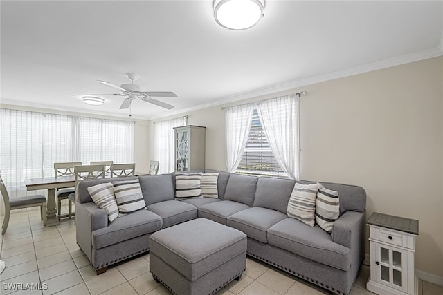 tiled living room featuring crown molding and ceiling fan