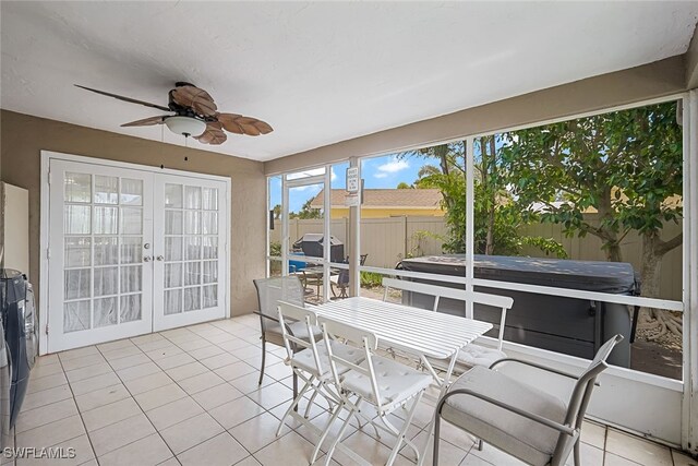 sunroom with ceiling fan and french doors