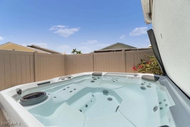 view of pool featuring a hot tub