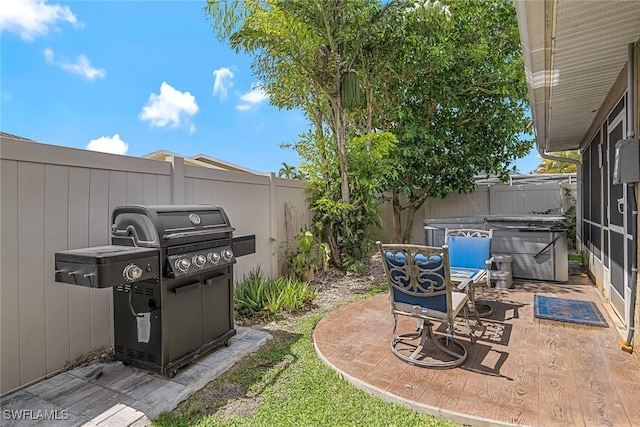 view of yard featuring a hot tub and a patio