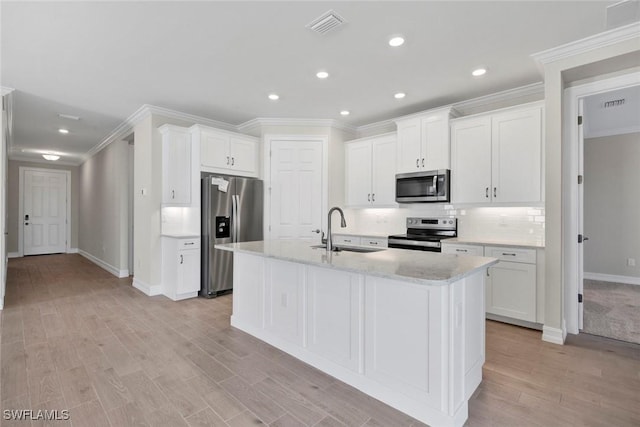 kitchen featuring white cabinetry, sink, and stainless steel appliances