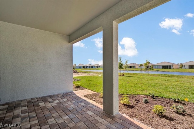 view of patio / terrace with a water view