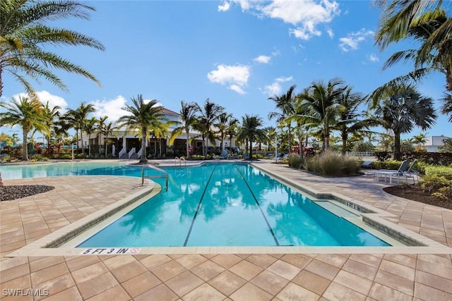 view of swimming pool with a patio