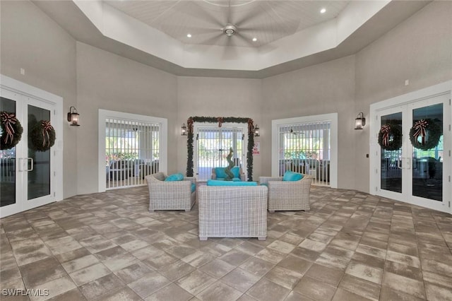 interior space with french doors, ceiling fan, and an outdoor living space