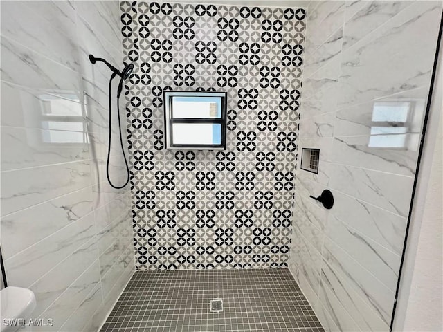 bathroom with tiled shower