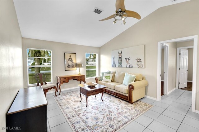 tiled living room featuring ceiling fan and lofted ceiling