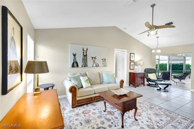 tiled living room featuring ceiling fan and lofted ceiling