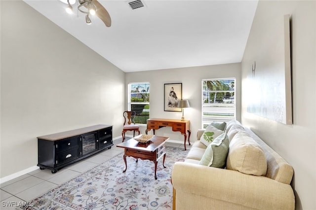 living room with lofted ceiling, a healthy amount of sunlight, light tile patterned floors, and ceiling fan