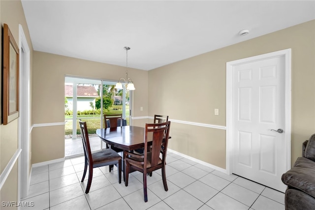 dining area featuring an inviting chandelier and light tile patterned flooring