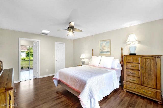 bedroom featuring ceiling fan, dark hardwood / wood-style flooring, and access to exterior