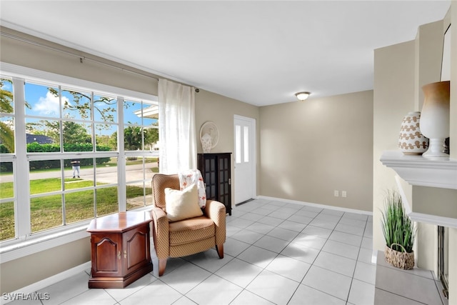 sitting room with a wealth of natural light and light tile patterned floors