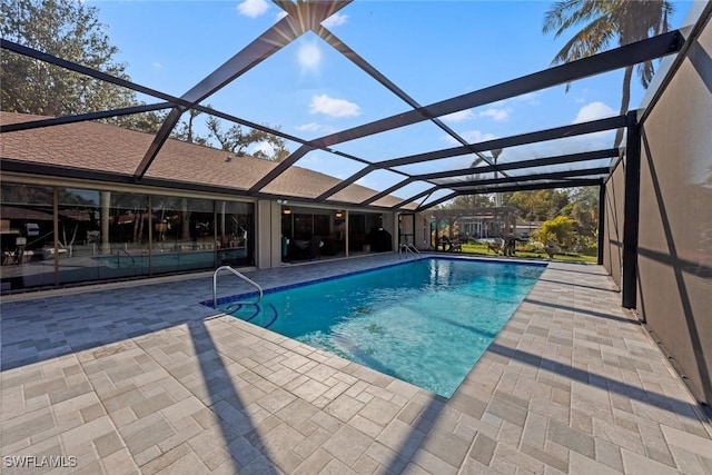 view of pool featuring a lanai and a patio