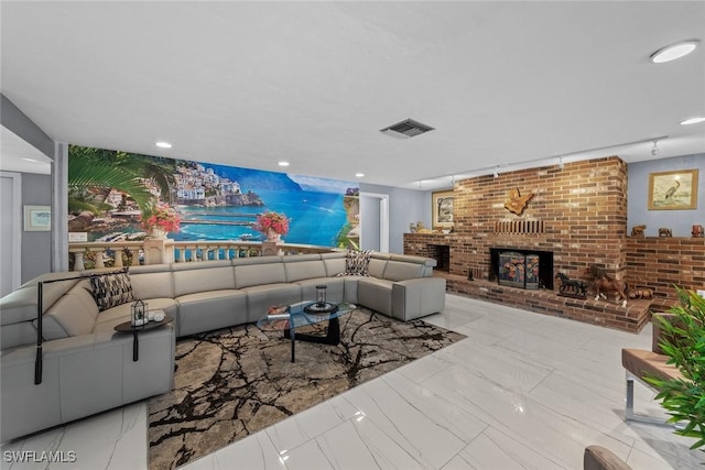 living room featuring a brick fireplace