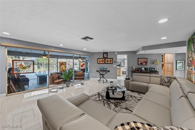 living room featuring a textured ceiling