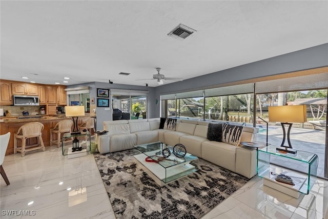 living room with ceiling fan