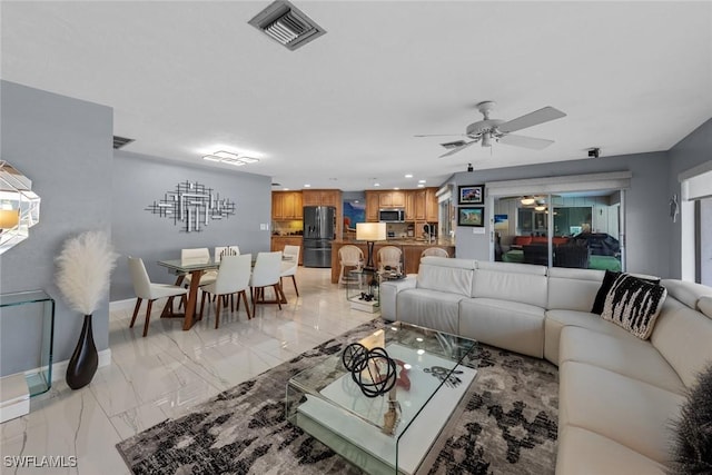 living room featuring ceiling fan