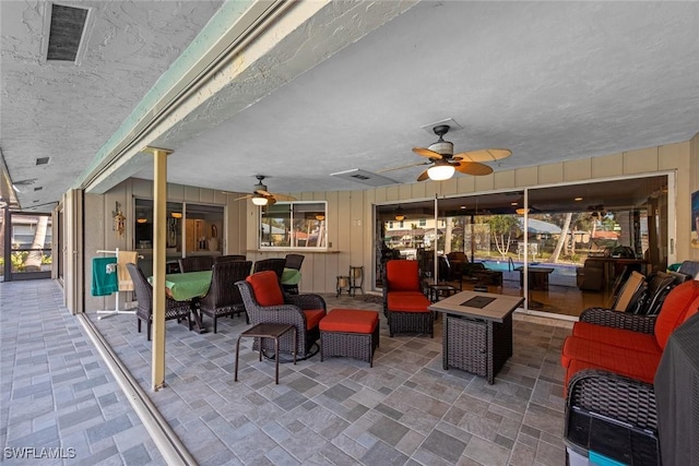 view of patio featuring ceiling fan and outdoor lounge area