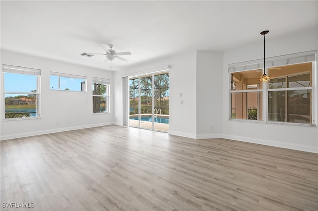 unfurnished room with light hardwood / wood-style floors and ceiling fan