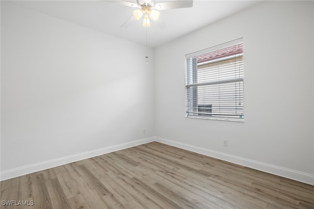 spare room featuring ceiling fan and light hardwood / wood-style floors