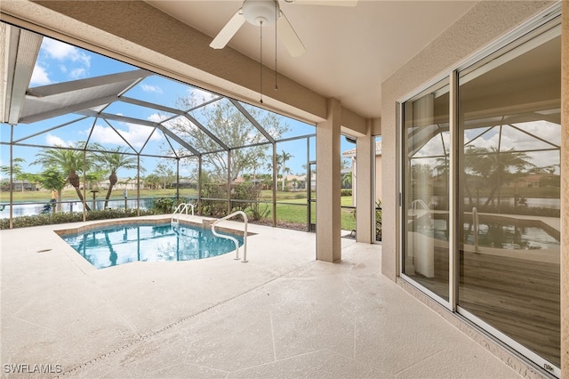 view of pool with a water view, a lanai, and a patio area