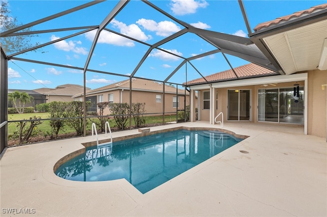 view of swimming pool with a lanai and a patio area