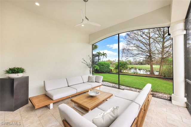 view of patio featuring a water view, ceiling fan, and outdoor lounge area