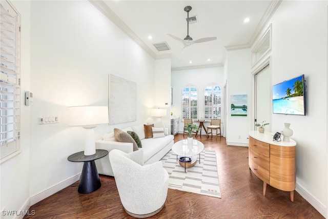 living room with ornamental molding, ceiling fan, and dark hardwood / wood-style flooring