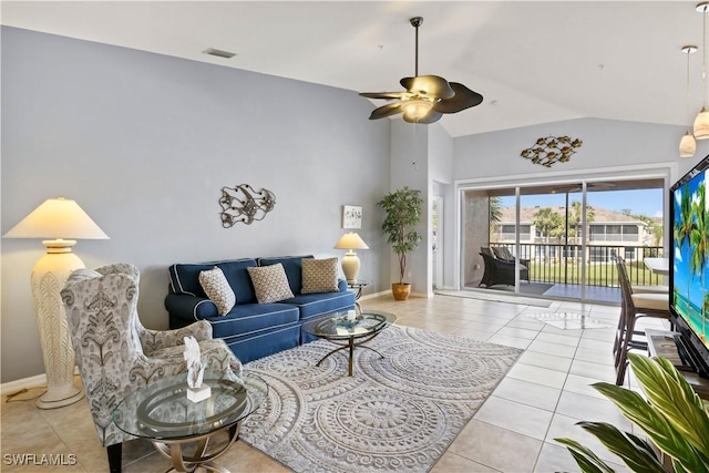 living room featuring light tile patterned floors, vaulted ceiling, and ceiling fan