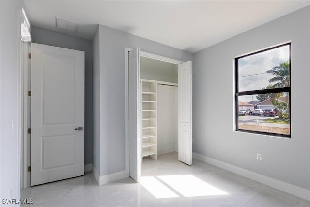 unfurnished bedroom featuring a closet