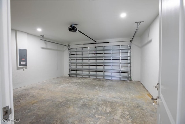 garage featuring a garage door opener and electric panel