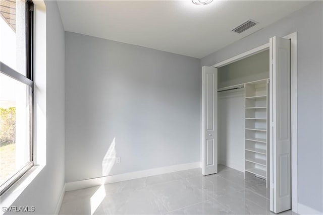 unfurnished bedroom featuring a closet