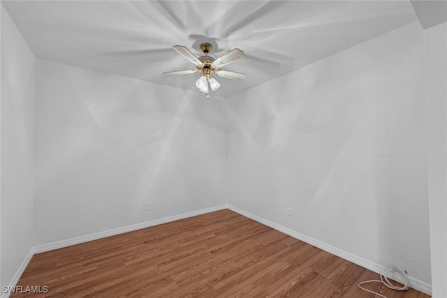 empty room featuring wood-type flooring and ceiling fan