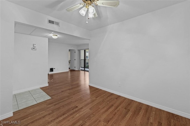 unfurnished room featuring hardwood / wood-style flooring and ceiling fan