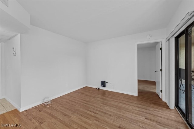 unfurnished room featuring light wood-type flooring