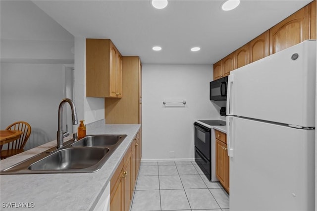 kitchen featuring sink, light tile patterned floors, and black appliances