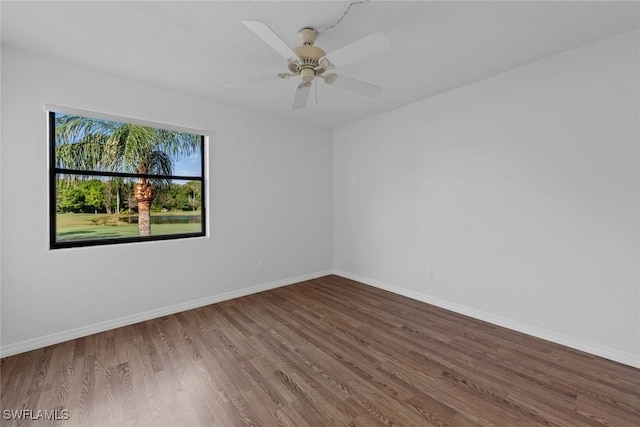 spare room featuring ceiling fan and hardwood / wood-style floors