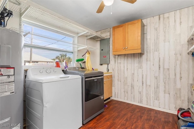 clothes washing area with water heater, electric panel, dark hardwood / wood-style floors, cabinets, and separate washer and dryer