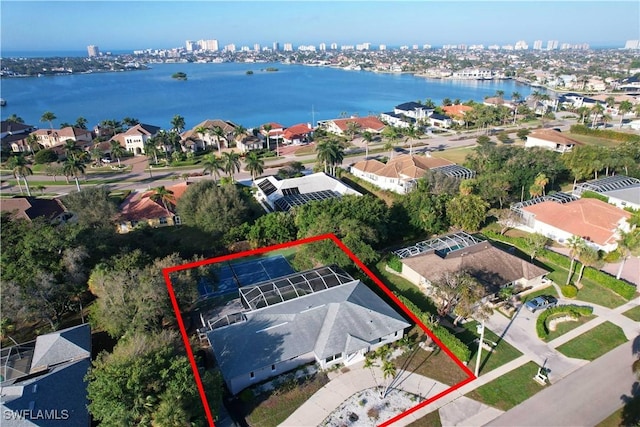 birds eye view of property featuring a water view