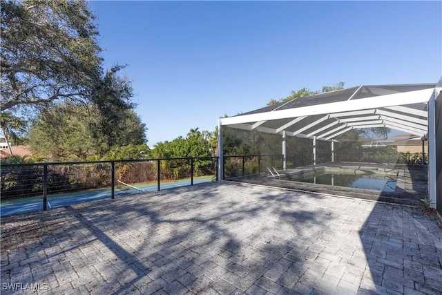 view of patio / terrace with a fenced in pool and a lanai