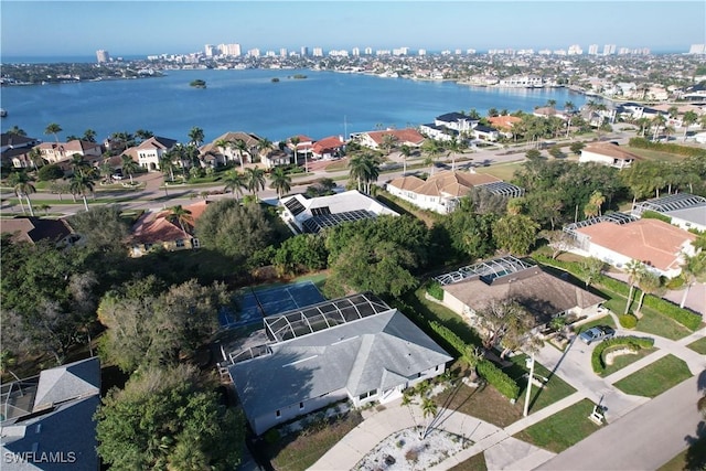 birds eye view of property with a water view