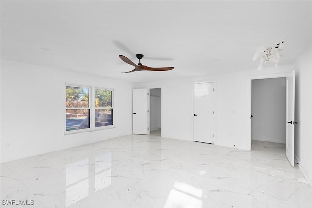 unfurnished room with ceiling fan