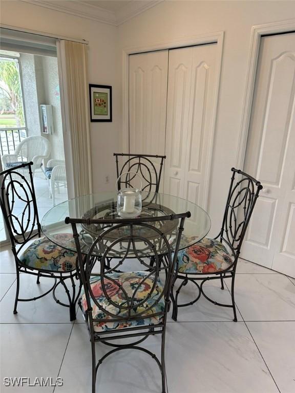 dining room featuring ornamental molding