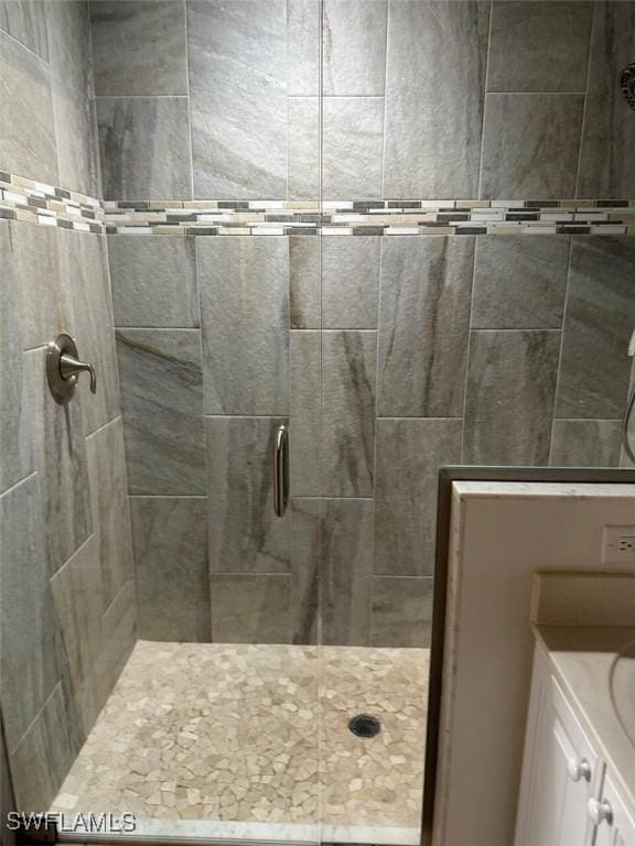 bathroom with a shower with door