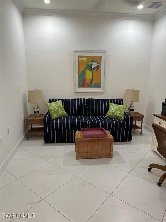 sitting room featuring crown molding