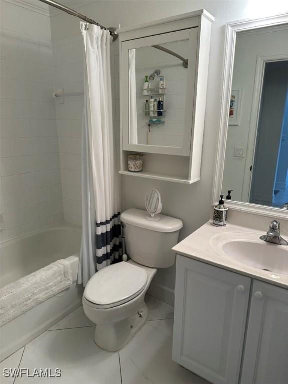 full bathroom featuring toilet, tile patterned floors, shower / tub combo with curtain, and vanity