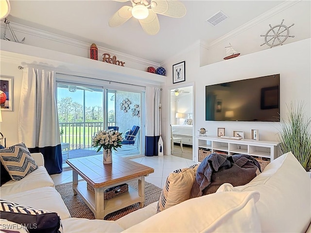 living room with tile patterned floors, a ceiling fan, visible vents, and ornamental molding