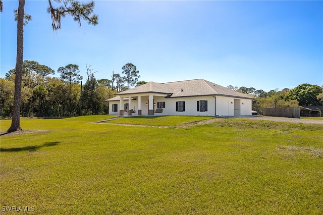 back of house with a yard