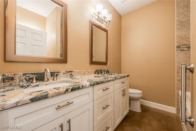 full bath with double vanity, toilet, baseboards, and a sink