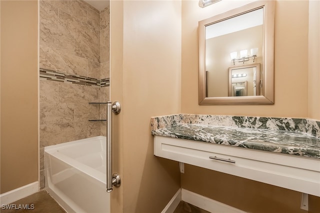 full bath with baseboards and bathing tub / shower combination